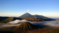 brown and black mountain under blue sky during daytime