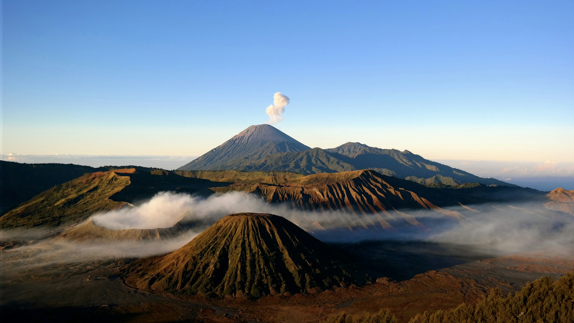 brown and black mountain under blue sky during daytime