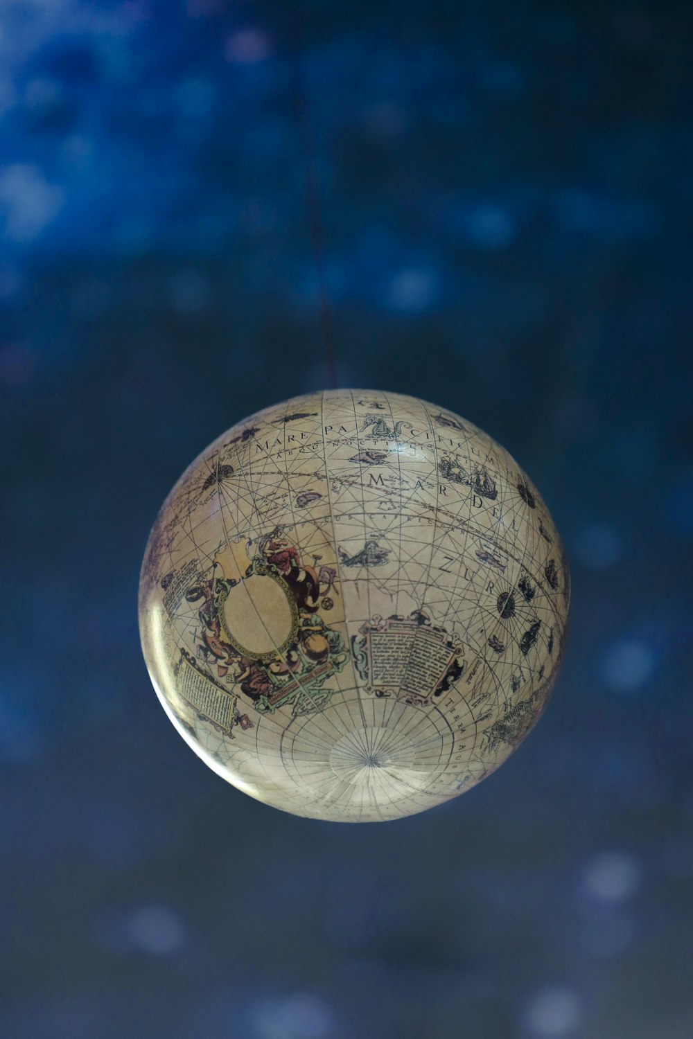 white and gray globe with blue background