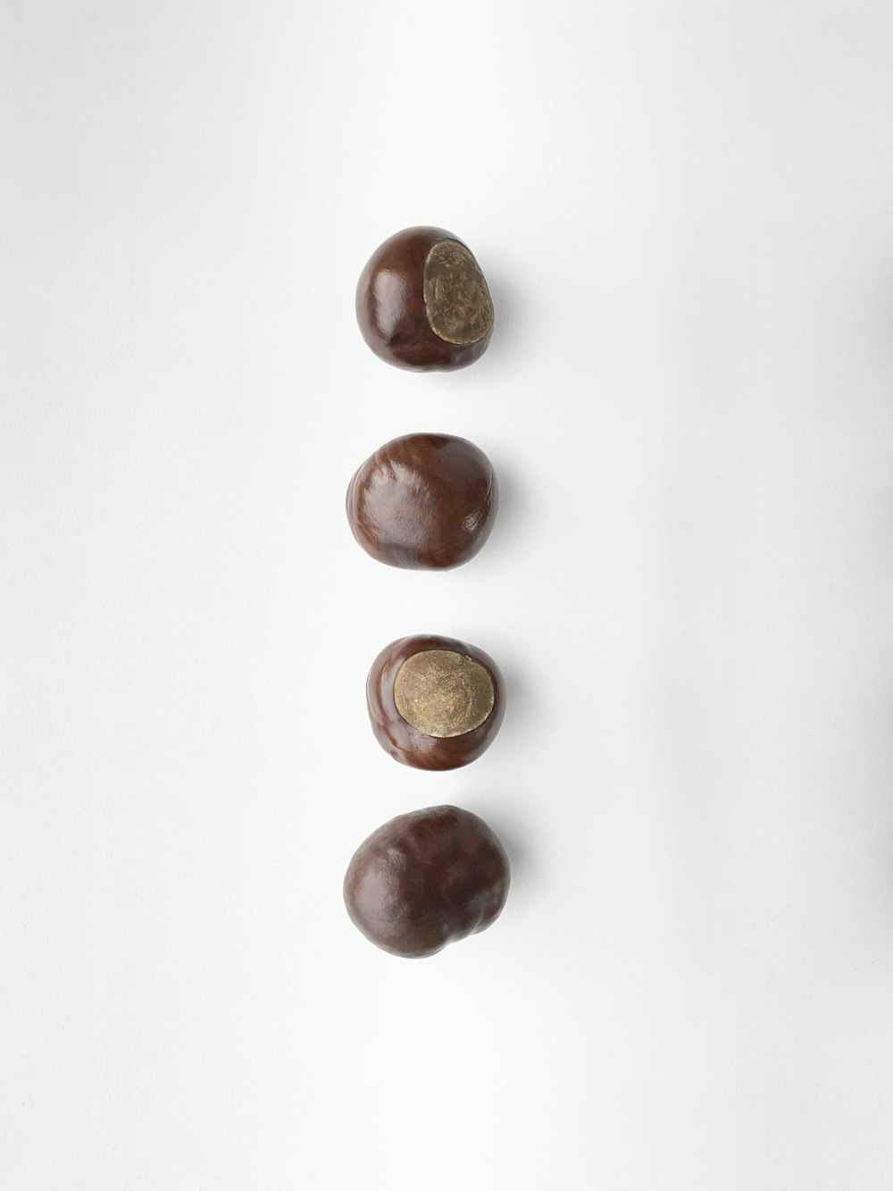 red round fruits on white surface