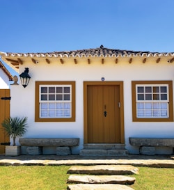 brown wooden door on brown concrete house