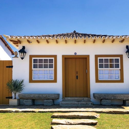 brown wooden door on brown concrete house