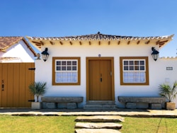 brown wooden door on brown concrete house