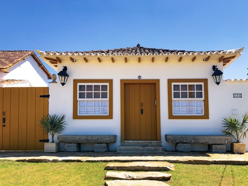 brown wooden door on brown concrete house