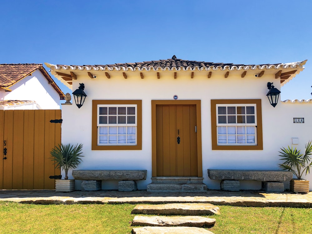 brown wooden door on brown concrete house