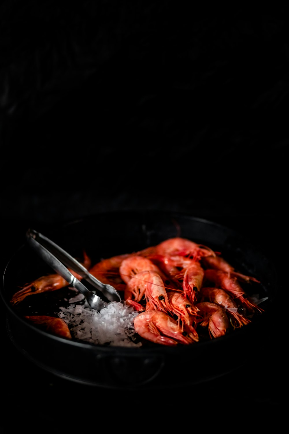 red chili on black round plate