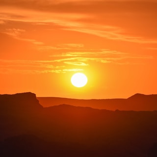 silhouette of mountain during sunset