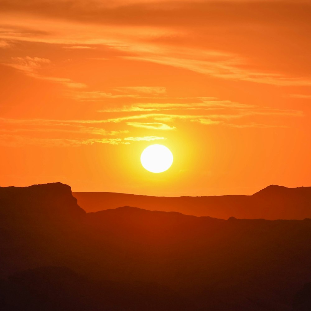 silhouette of mountain during sunset