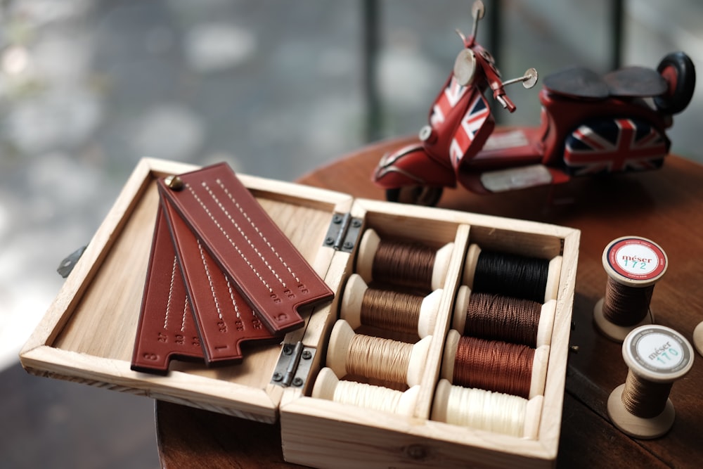 red hardbound books on brown wooden rack