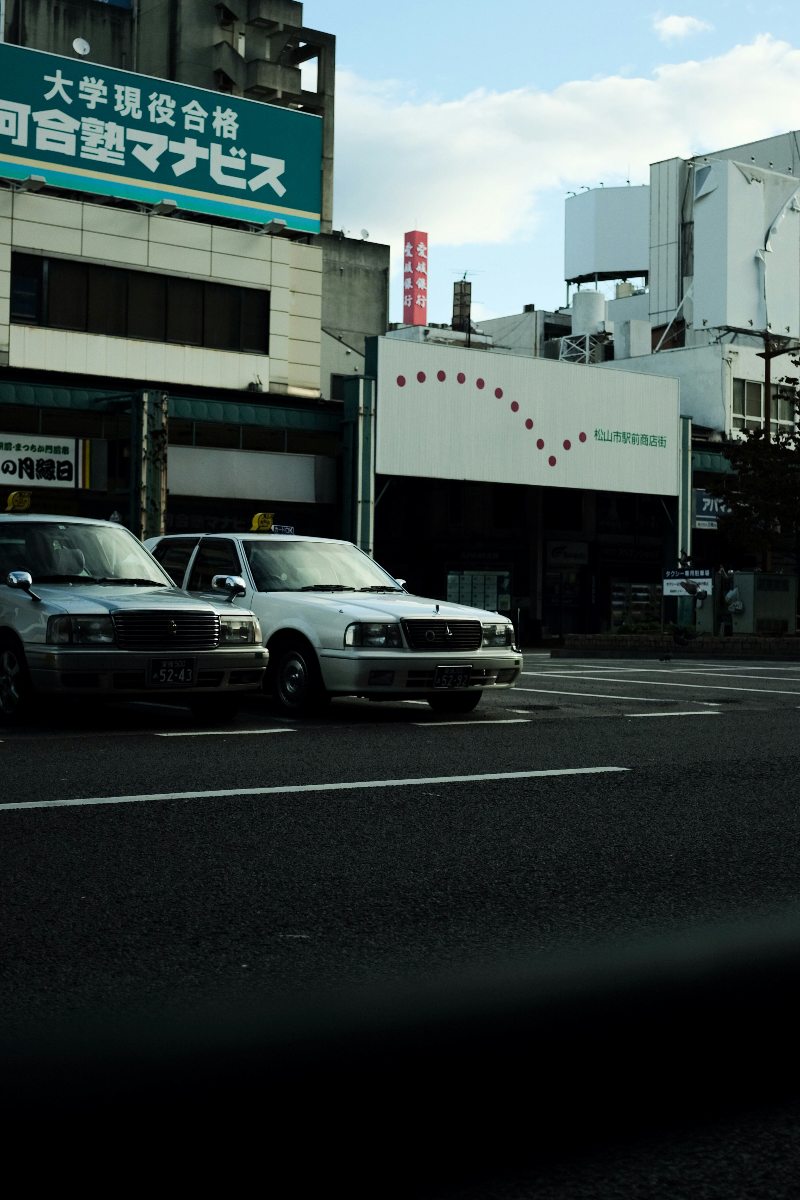 silver sedan on road during daytime
