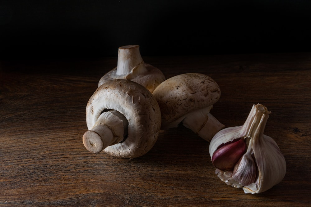 brown mushrooms on brown wooden table