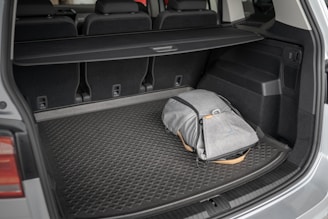 gray and yellow bag on car seat