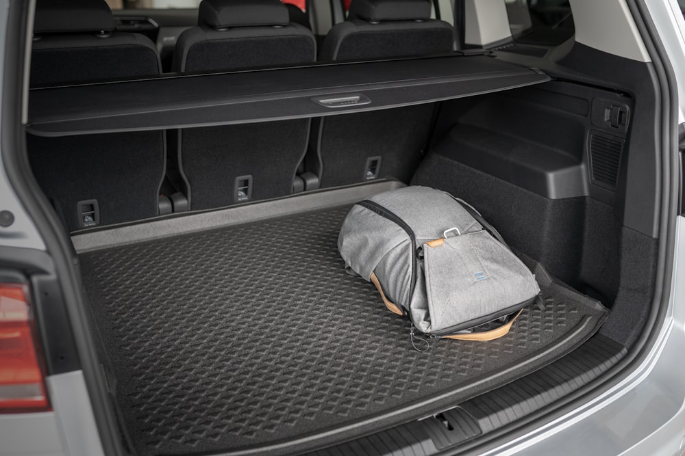 gray and yellow bag on car seat