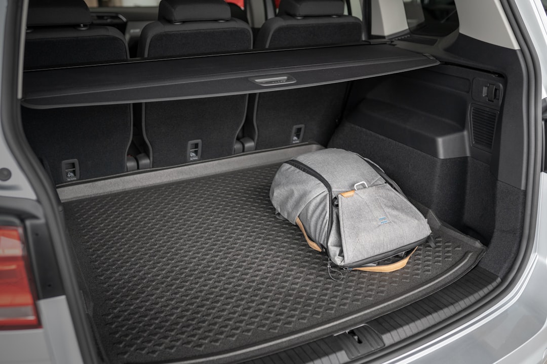 gray and yellow bag on car seat, Peak Design in a car trunk (Volkswagen Touran)