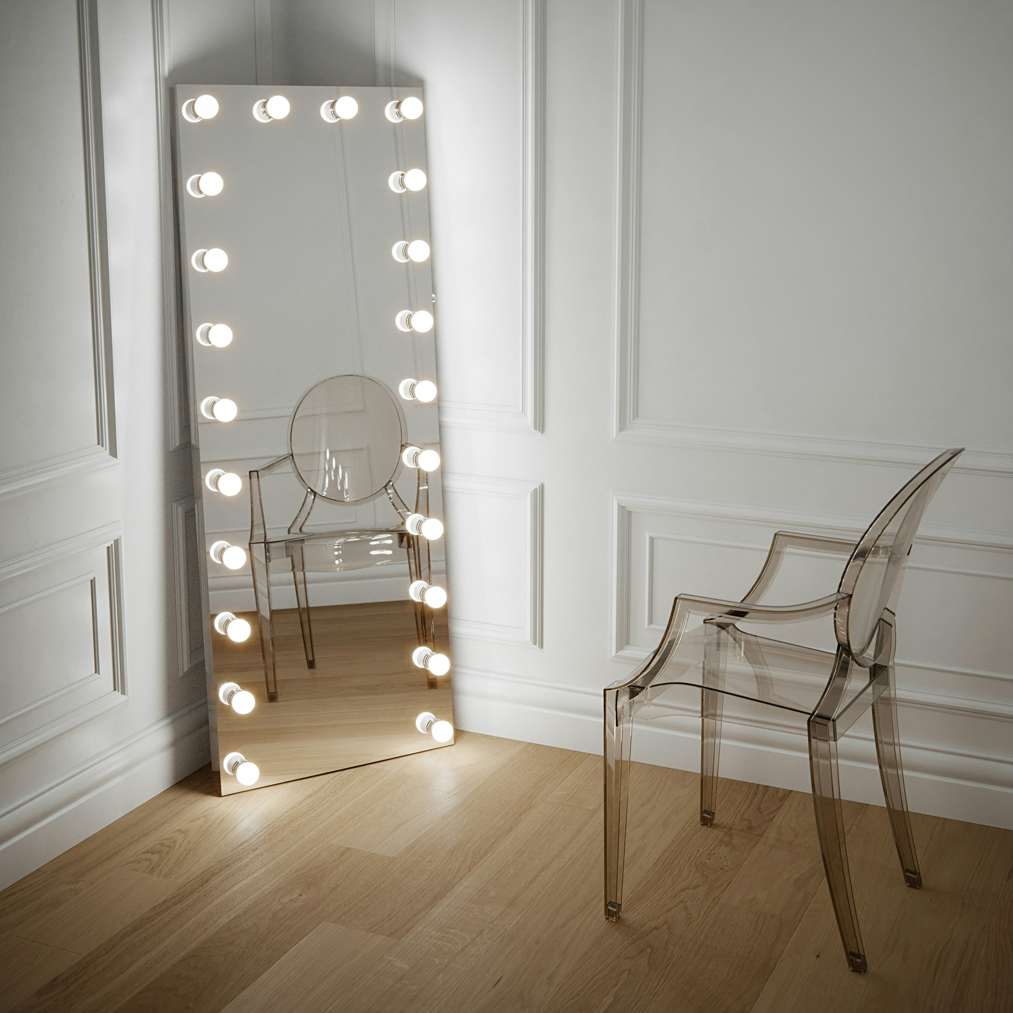 Full length mirror Hollywood style with led bulbs.

Leaner mirror against a white panelled wall and crystal Kartell Louis ghost chair by Philippe Starck