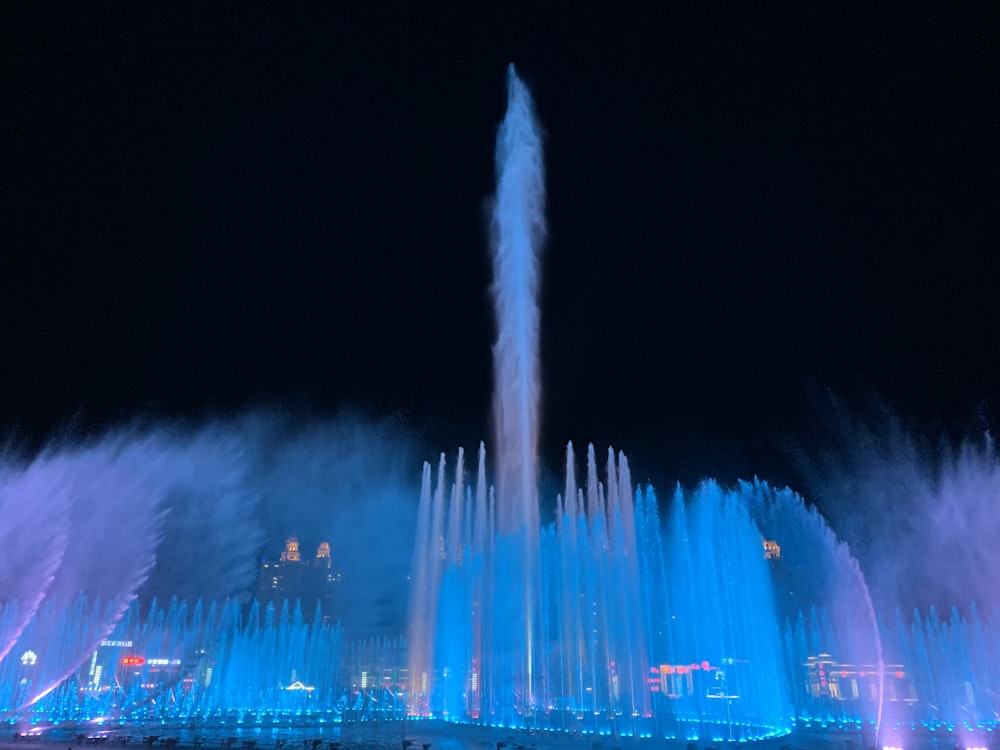 water fountain with lights during night time