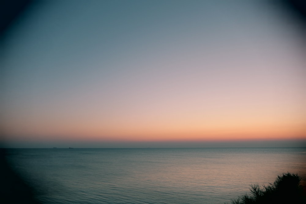 body of water under blue sky during daytime