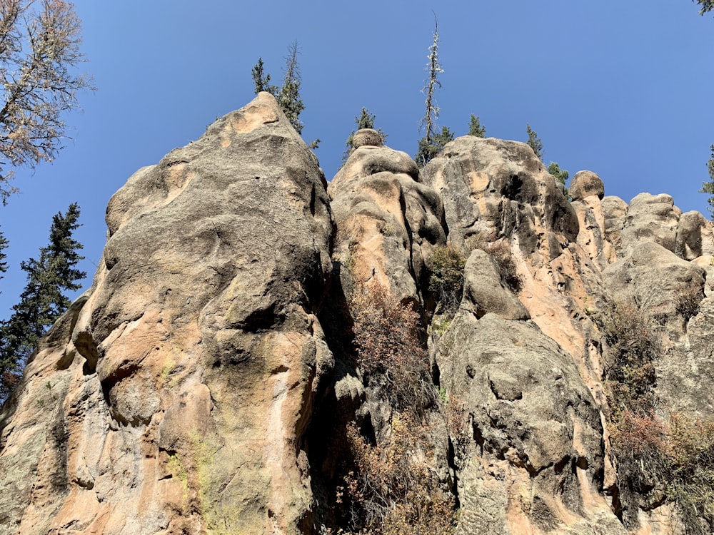 brown rocky mountain under blue sky during daytime