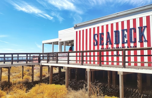 A charming local seaside restaurant with colorful tables and fresh seafood dishes.