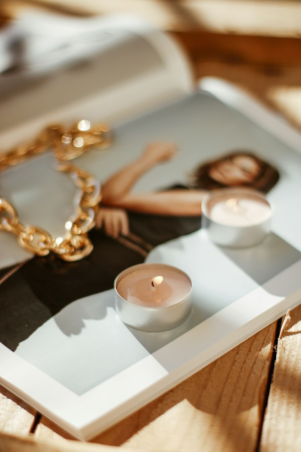 gold beaded necklace on white ceramic tray