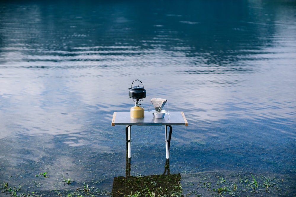 black kettle on brown wooden table