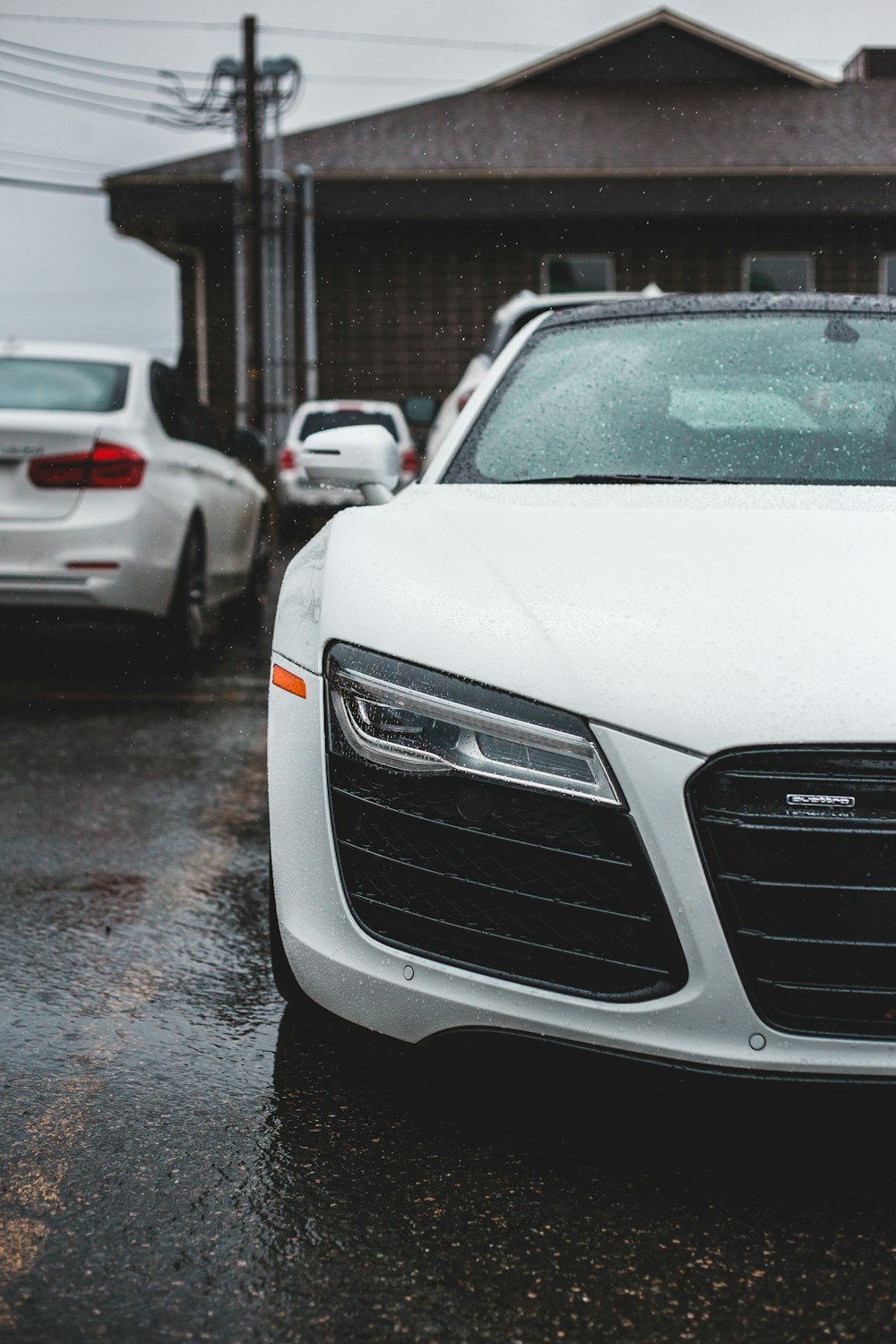 white audi car on road during daytime