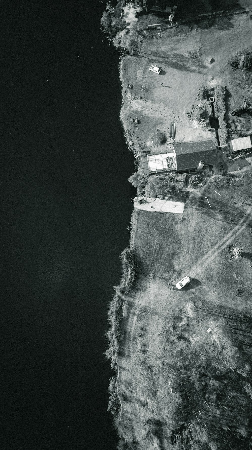 aerial view of houses near body of water