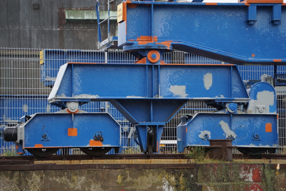 blue and white train on rail tracks during daytime