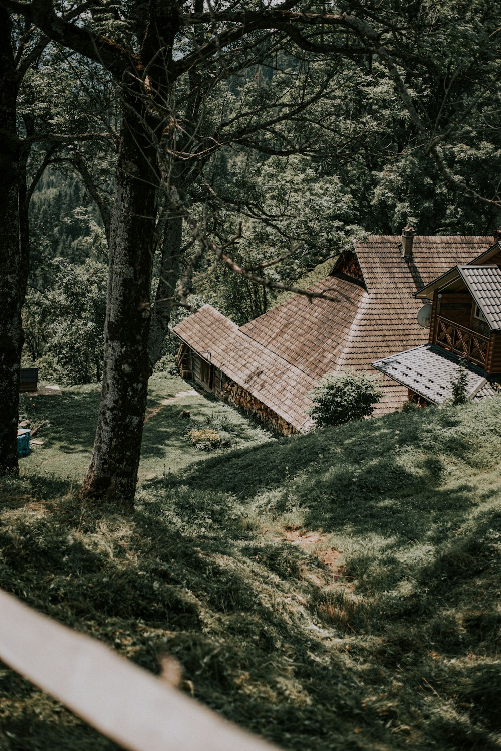 brown brick house on green grass field