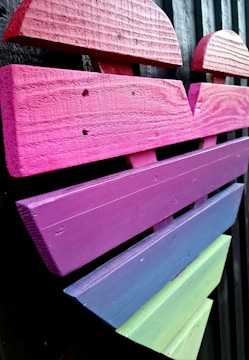 A heart-shaped collage of colorful artworks representing charitable causes