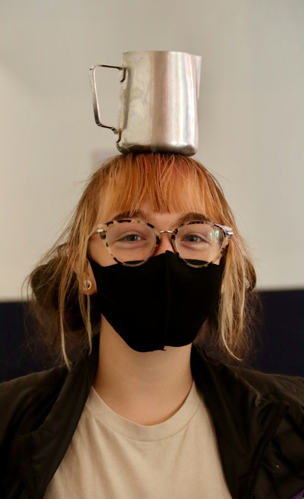 woman in black shirt wearing black mask