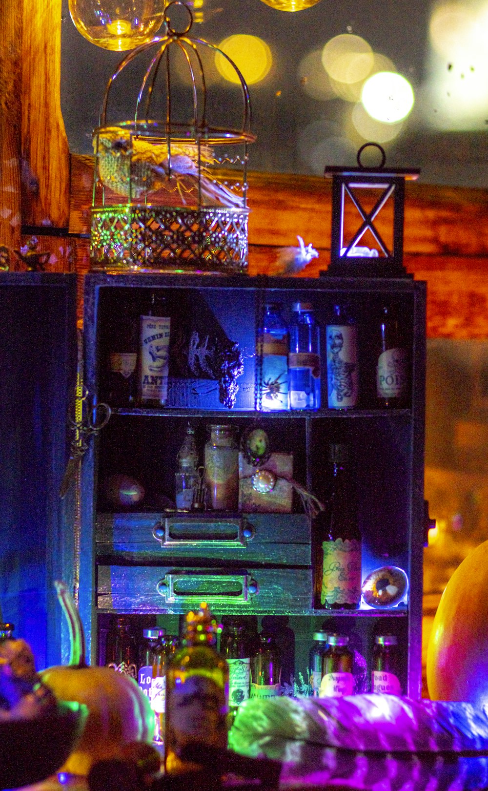 a shelf filled with lots of bottles of liquor