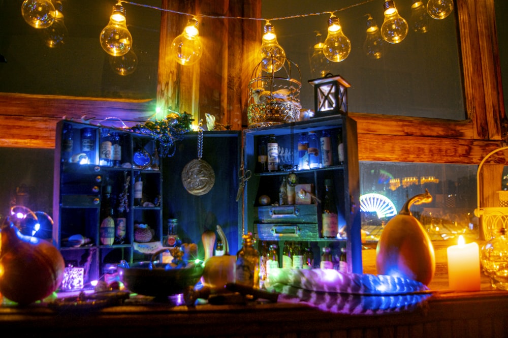 lighted candles on brown wooden shelf