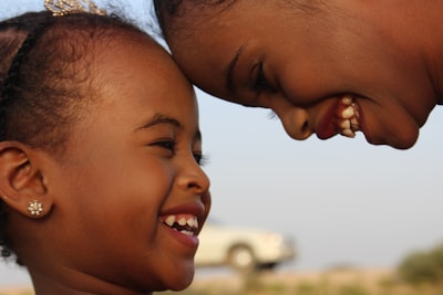 smiling boy and girl during daytime somalia teams background