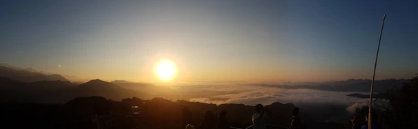 Sunrise view over Mount Rinjani with hikers starting their trek