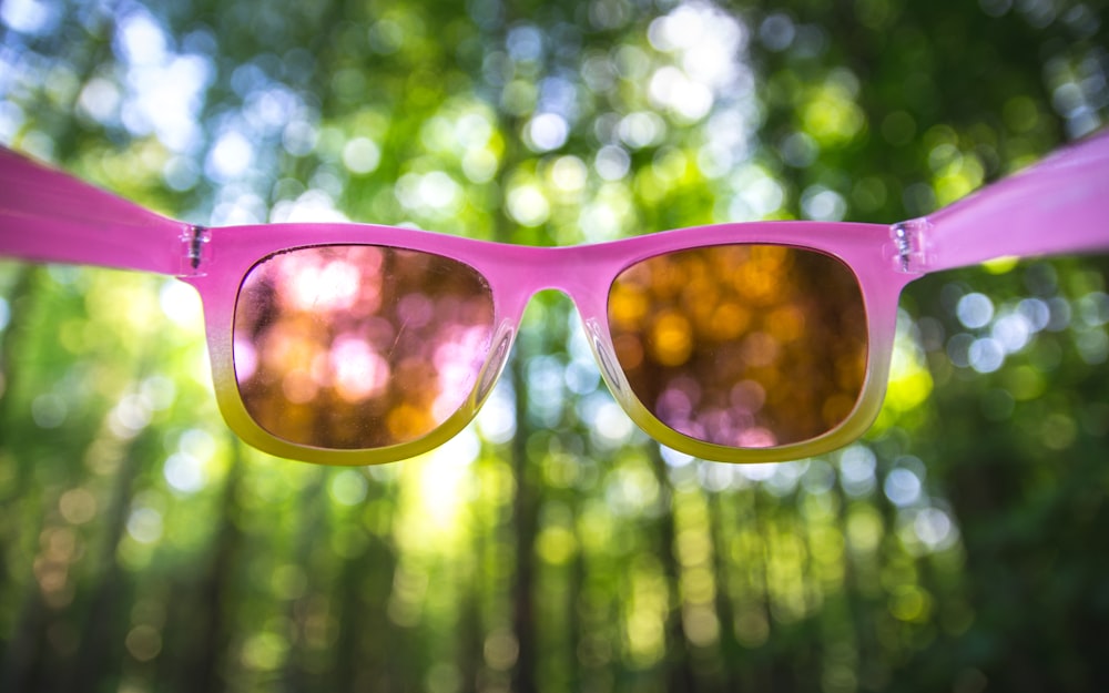 pink framed sunglasses with yellow lens