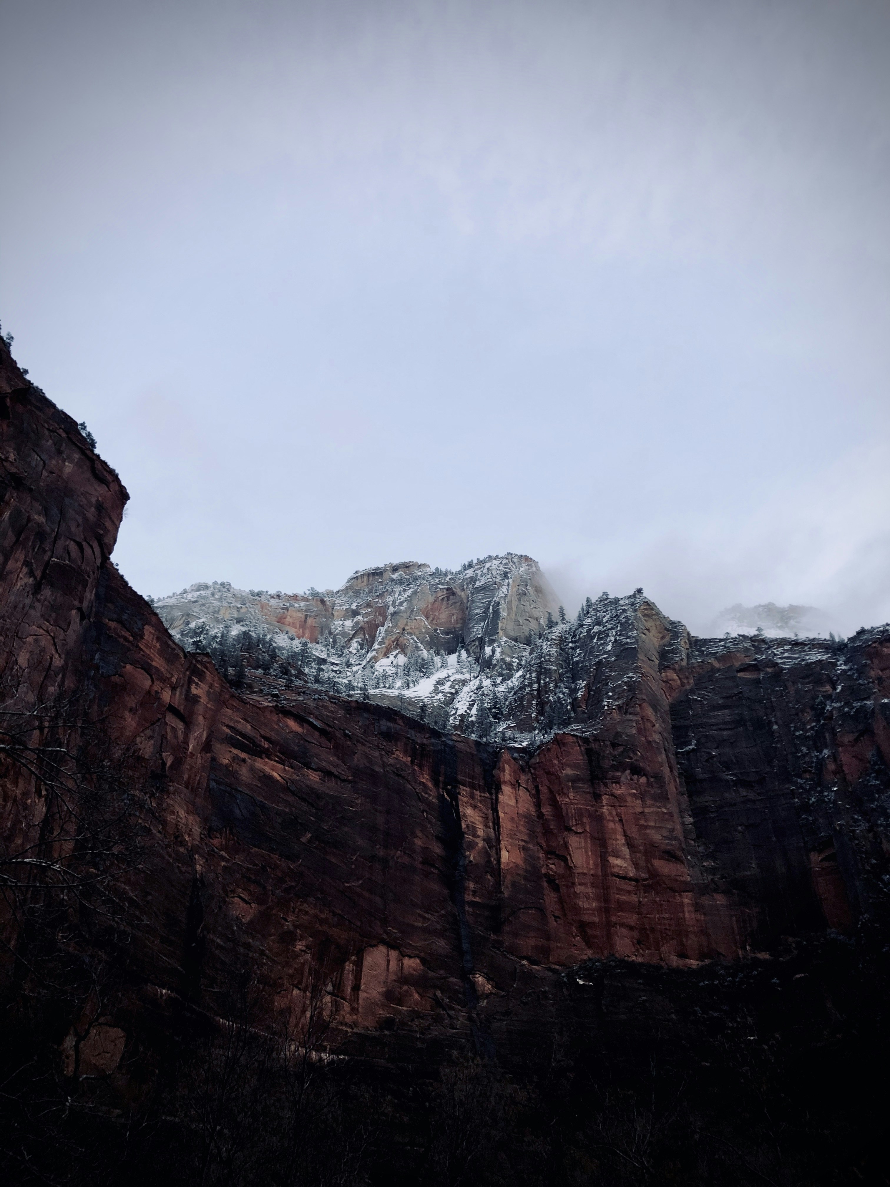 brown rocky mountain under white sky during daytime