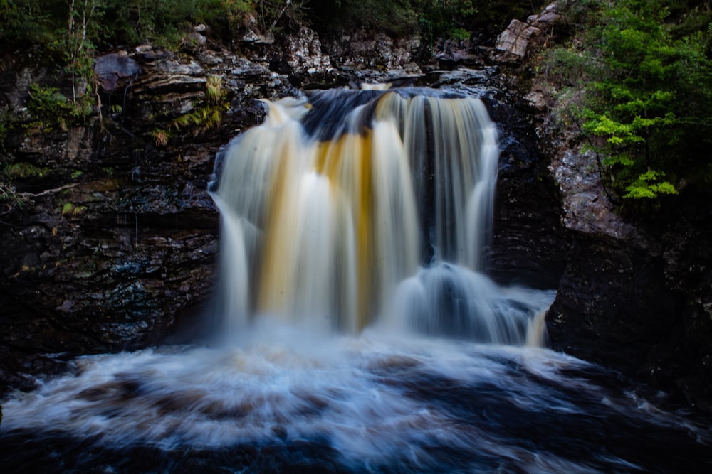 time lapse photography of water falls