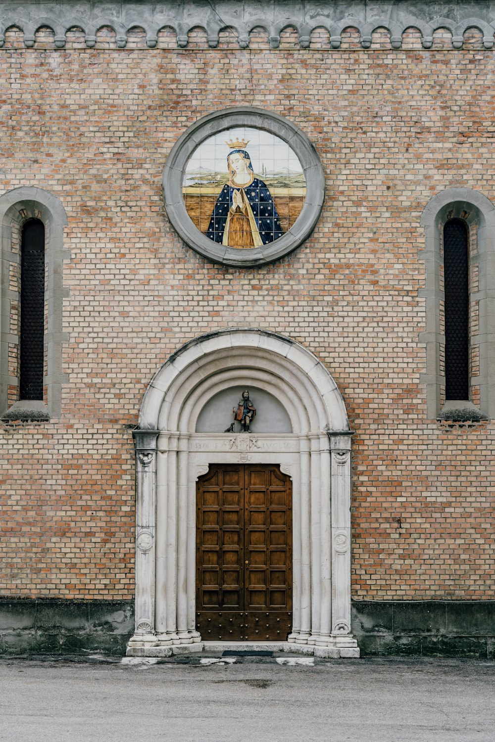 brown brick building with brown wooden door