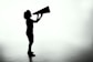 silhouette of woman holding rectangular board