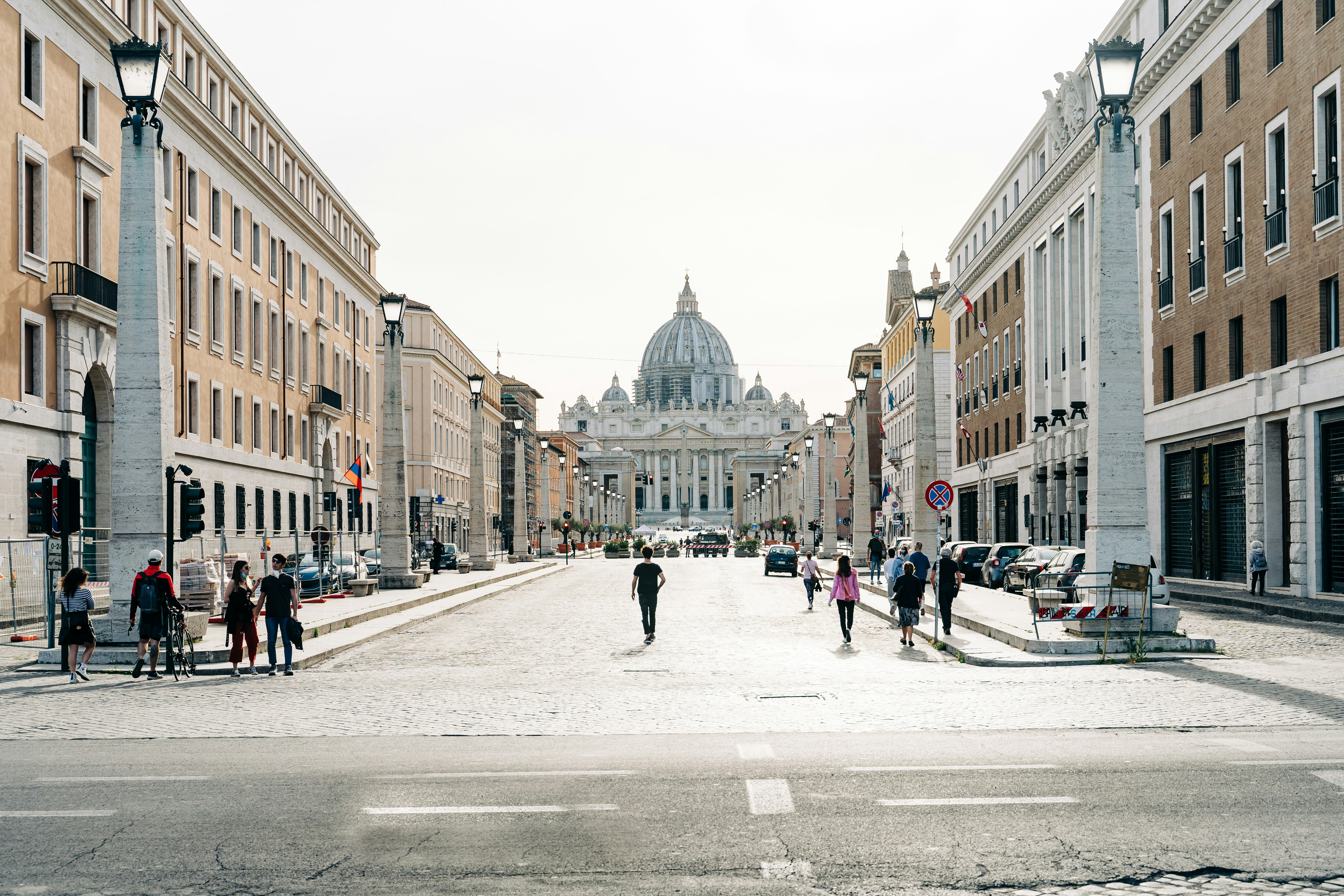 people walking on street near buildings during daytime