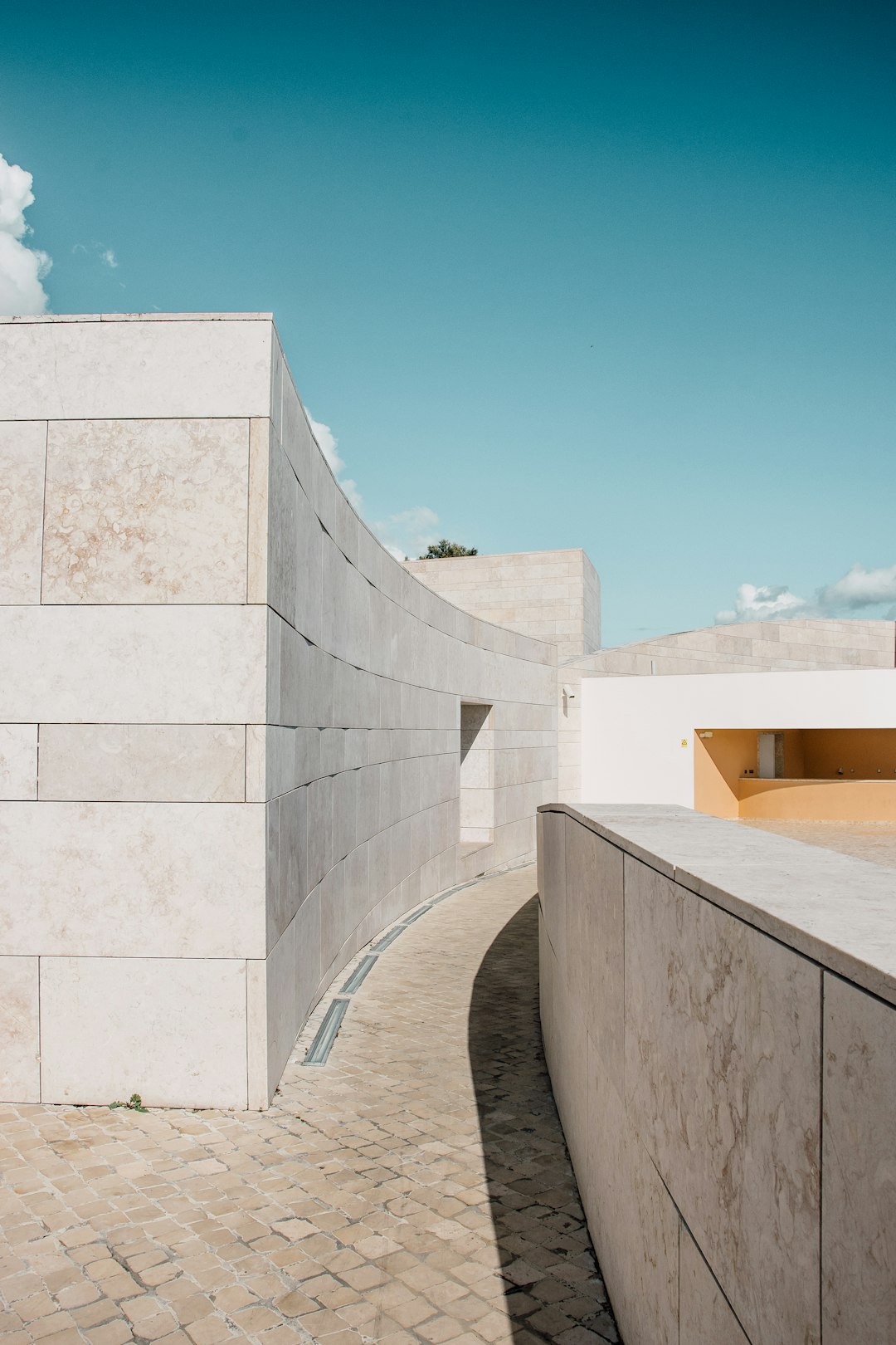 white concrete building under blue sky during daytime