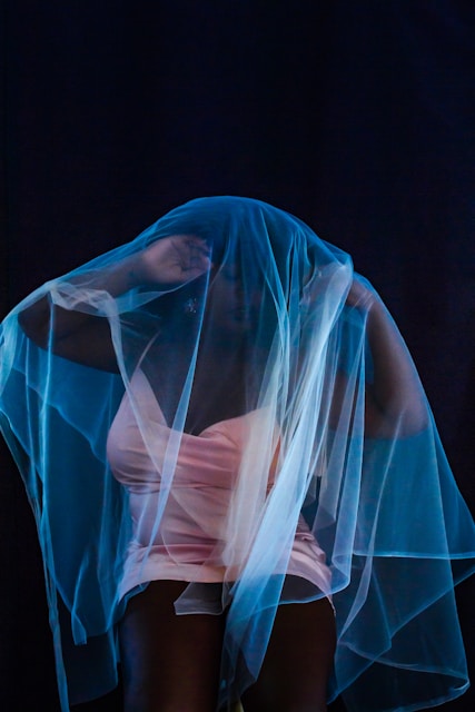 white sheer textile on blue textile