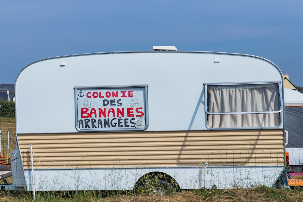 a trailer with a sign on the side of it