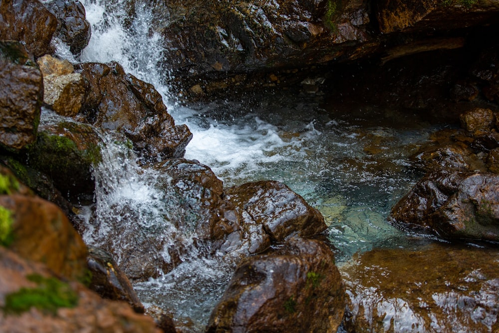 water falls on rocky mountain