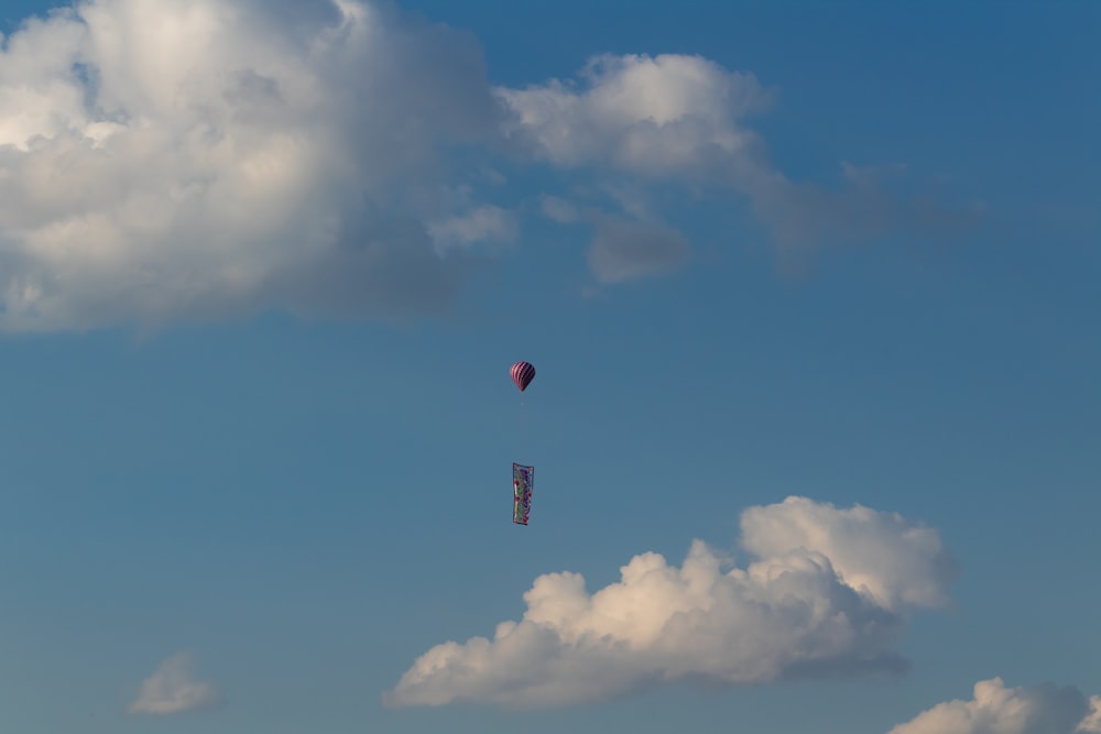 red hot air balloon in the sky