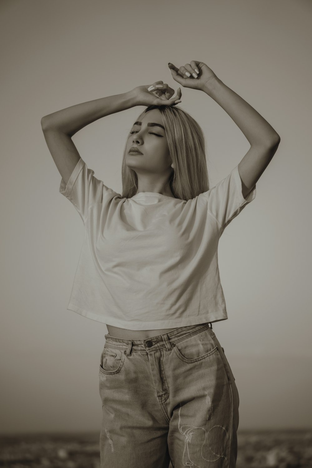 woman in white tank top and blue denim shorts