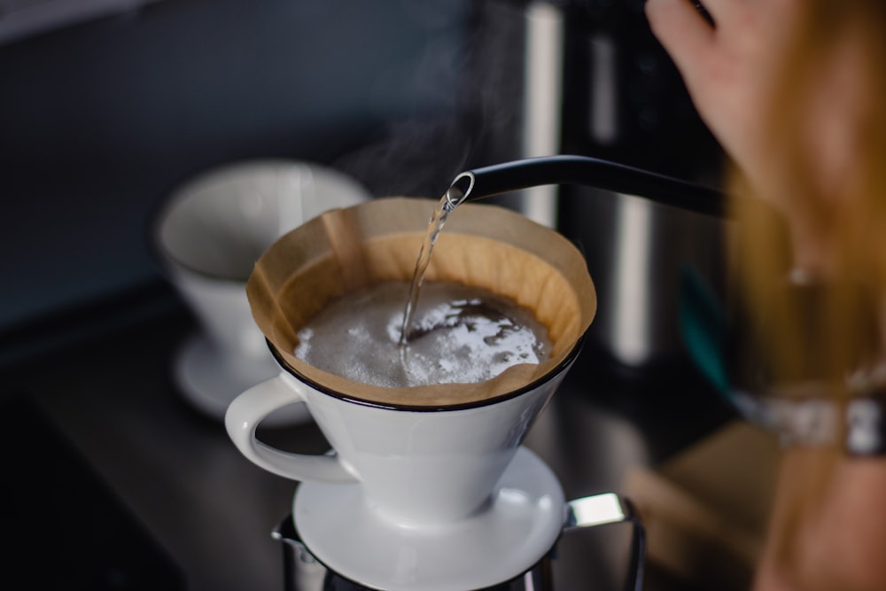 white ceramic cup with coffee