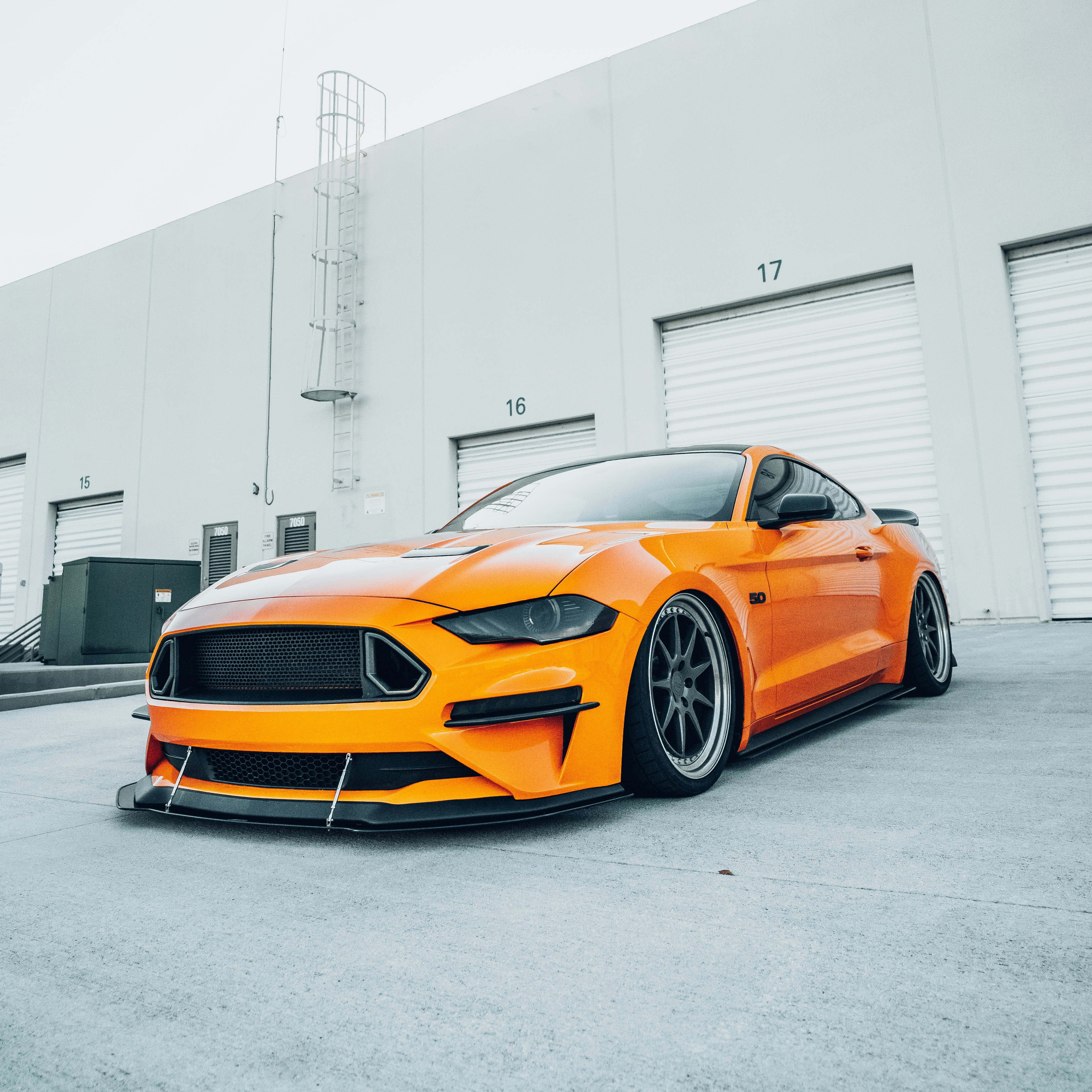 orange and black chevrolet camaro