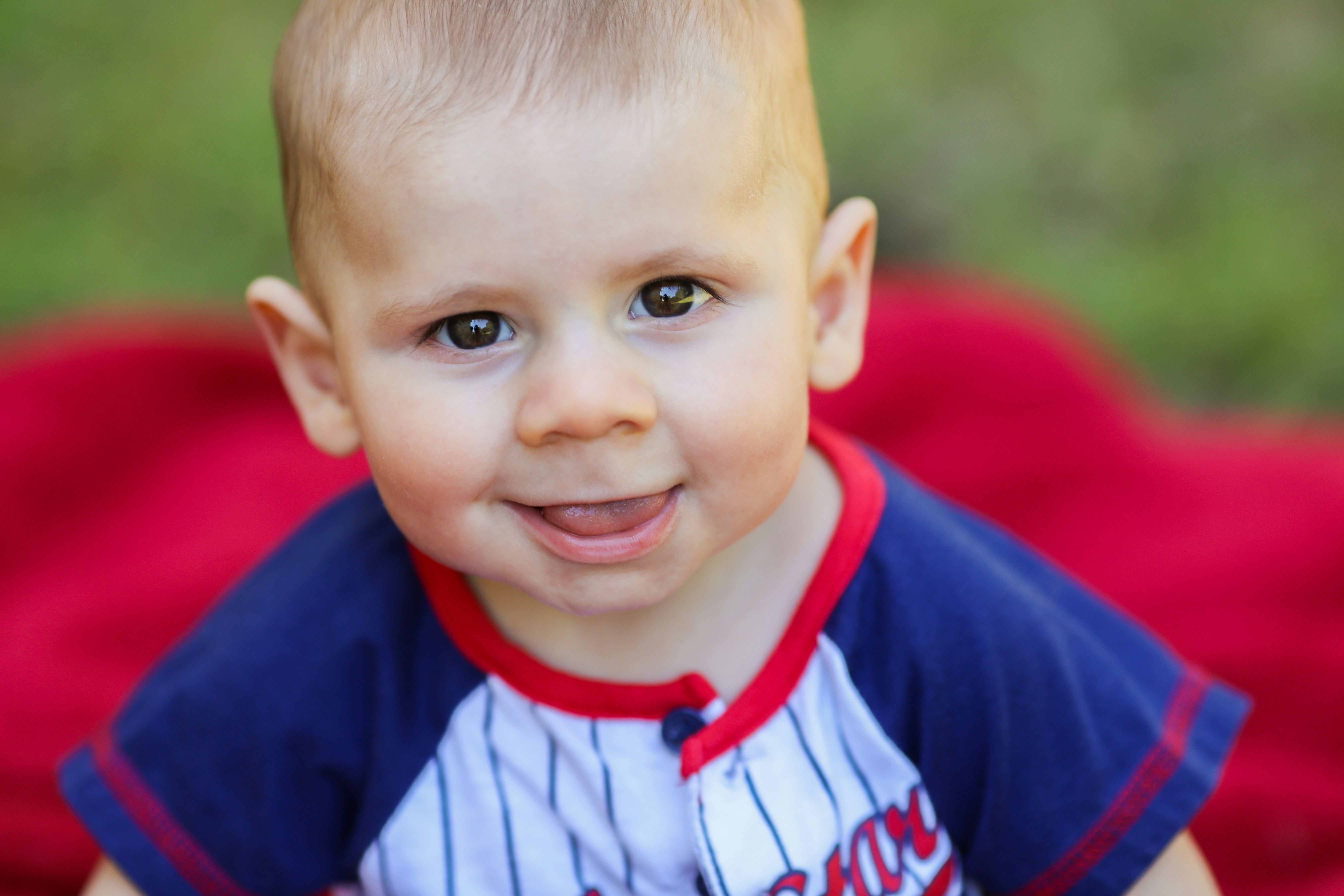 Boy in blue and white striped shirt smiling